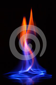 Flame of burning alcohol on black background. Gas flame. Black background. Abstract blaze fire flame texture background