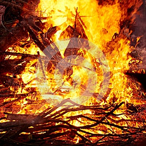 Flame of a burning bonfire at night