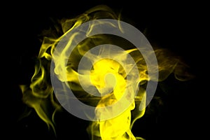 Flame dance in yellow color. black background.