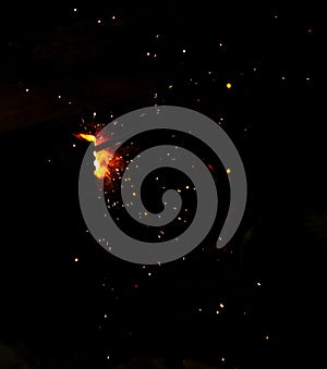 Flame of fire and sparks from welding metal at night