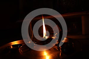 Flame light prayer devotional dark background