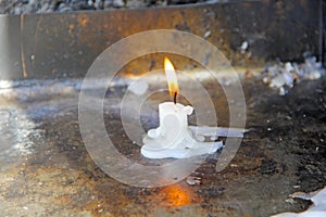 Flame lit in wax candle photo