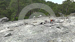 Flame of Methane Underground Emerges From Crack Between Rocks and Burns to Earth