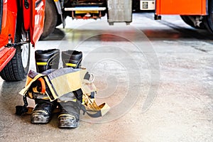 Flame retardant fireman`s boots and pants ready to be used in case of emergency