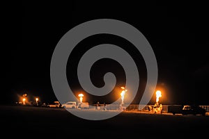 Flame rising from gas fire burners of hot air balloon in row at night