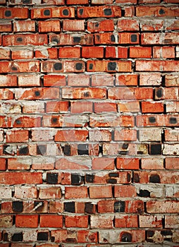 Flamed brick wall, textured background photo