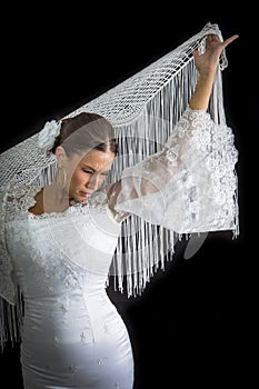 Flamenco dancer backs with white dress and hands crossed up