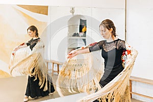 flamenco dancer reflected in the dance studio mirror