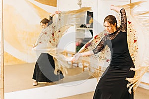 Flamenco female dancer with shawl in motion