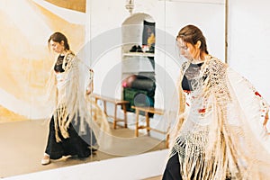 Flamenco female dancer training focused on a studio