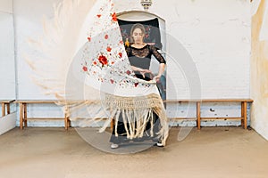 Flamenco woman dancer dancing with flower shawl