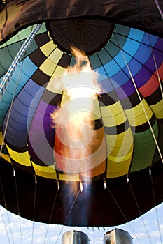 Flames from a burner inside a hot-air balloon envelop