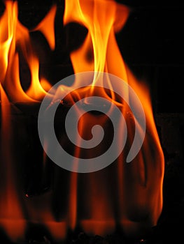 Flames coming from a log on fire