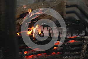 Flames engulf the burning log