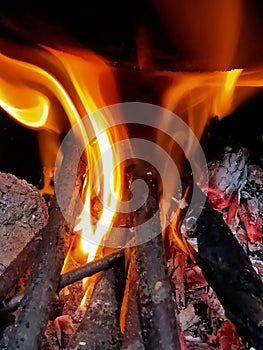 Flames of fire in a earth stove.