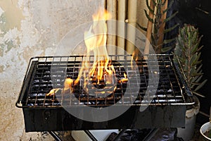 Flames fire with empty grill grid