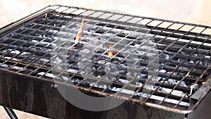 Flames fire with empty grill grid. Filmed on high speed cinema camera.