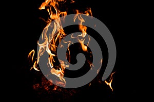 Flames and wood burning in a firepit