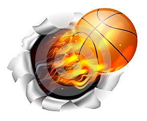 Flaming Basketball Ball Tearing a Hole in the Background photo