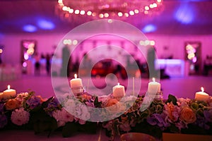 Flaming candles and flowers wedding decoration