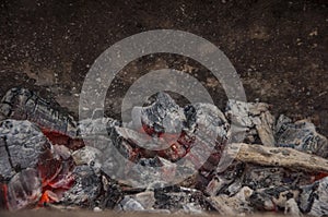 Flaming Charcoal In BBQ Grill Pit Isolated On Black Background