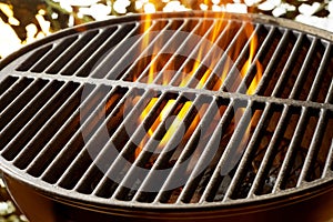 Flaming coals in a portable summer barbecue