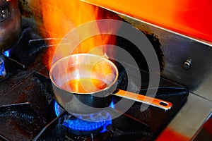 Flaming Cooking Pan in restaurant kitchen