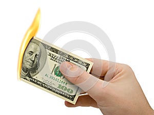 Flaming money in hand