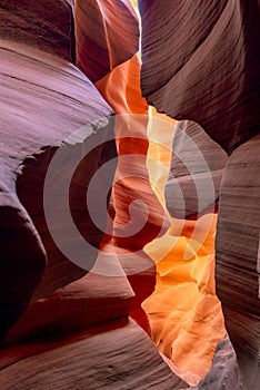 Flaming sandstones stacked into flaky fire waves in a sand maze in Lower Antelope Canyon in Page Arizona