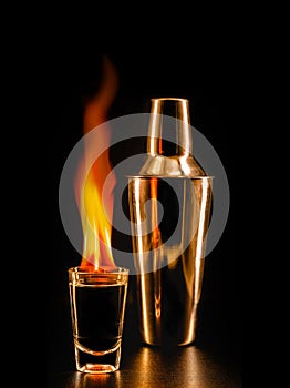 Flaming tequila, mexican drink served with fire, incandescent drink