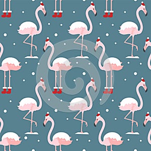 Flamingo in Christmas hat seamless pattern on blue background. Exotic New Year background. Christmas design for fabric, wallpaper,