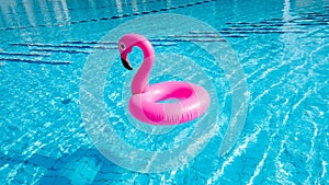 Flamingo tropical. Pink inflatable flamingo in water for summer beach background. Pool float party.