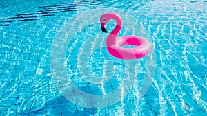 Flamingo tropical. Pink inflatable flamingo in water for summer beach background. Pool float party.