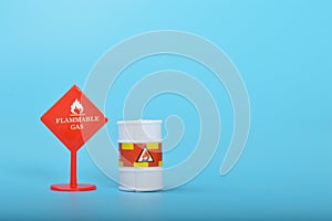 Flammable liquid gas warning sign isolated on a blue background