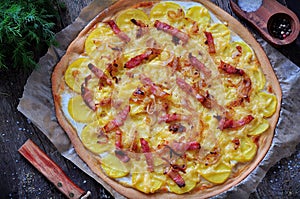 Flammekueche tartiflette, French traditional dish tart Flambe with onion, bacon and potato