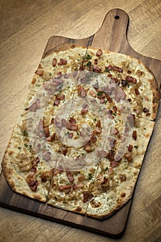Flammkuchen tarte flambee rectangular pizza with bacon and chicken