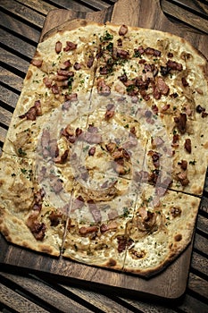 Flammkuchen tarte flambee rectangular pizza with bacon and chicken