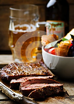 Flank steak with tomato salad.