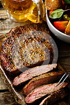 Flank steak with tomato salad.