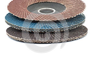 Flap discs for angle grinders in close-up over white