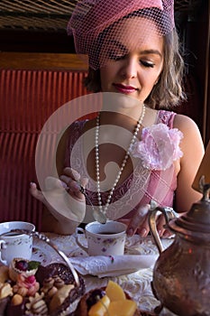 Flapper dress 1920 lady choosing biscuits in train