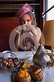 Flapper dress 1920 lady drinking tea in steam train