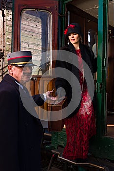 Flapper dress lady getting on train