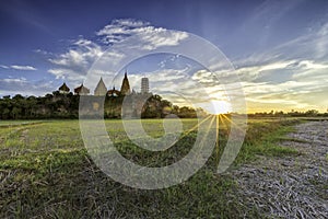 Flare sunset with temple Thailand