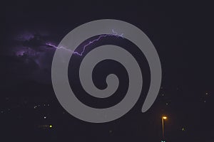 Flash of beautiful purple lightning on the sky