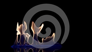 Flash and fire streak of flammable liquid or gasoline against black reflective background. An explosion of fire, flaming