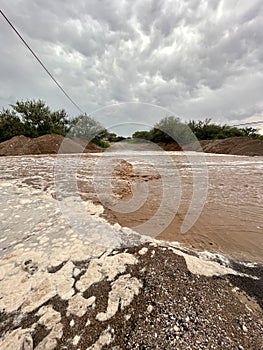 Flash flood on a rural Arizona road after heavy rain