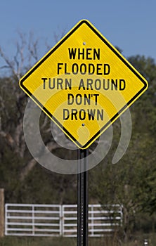 Flash flood sign says When Flooded Turn Around Don`t DrownFlash flood sign says When Flooded Turn Around Don`t Drown