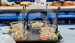 Flash frozen ice cream balls in a single serving cup tray for a party