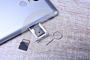 Flash memory data storage concept : A tray with a micro SD card on white background. A memory card is used for storing digital